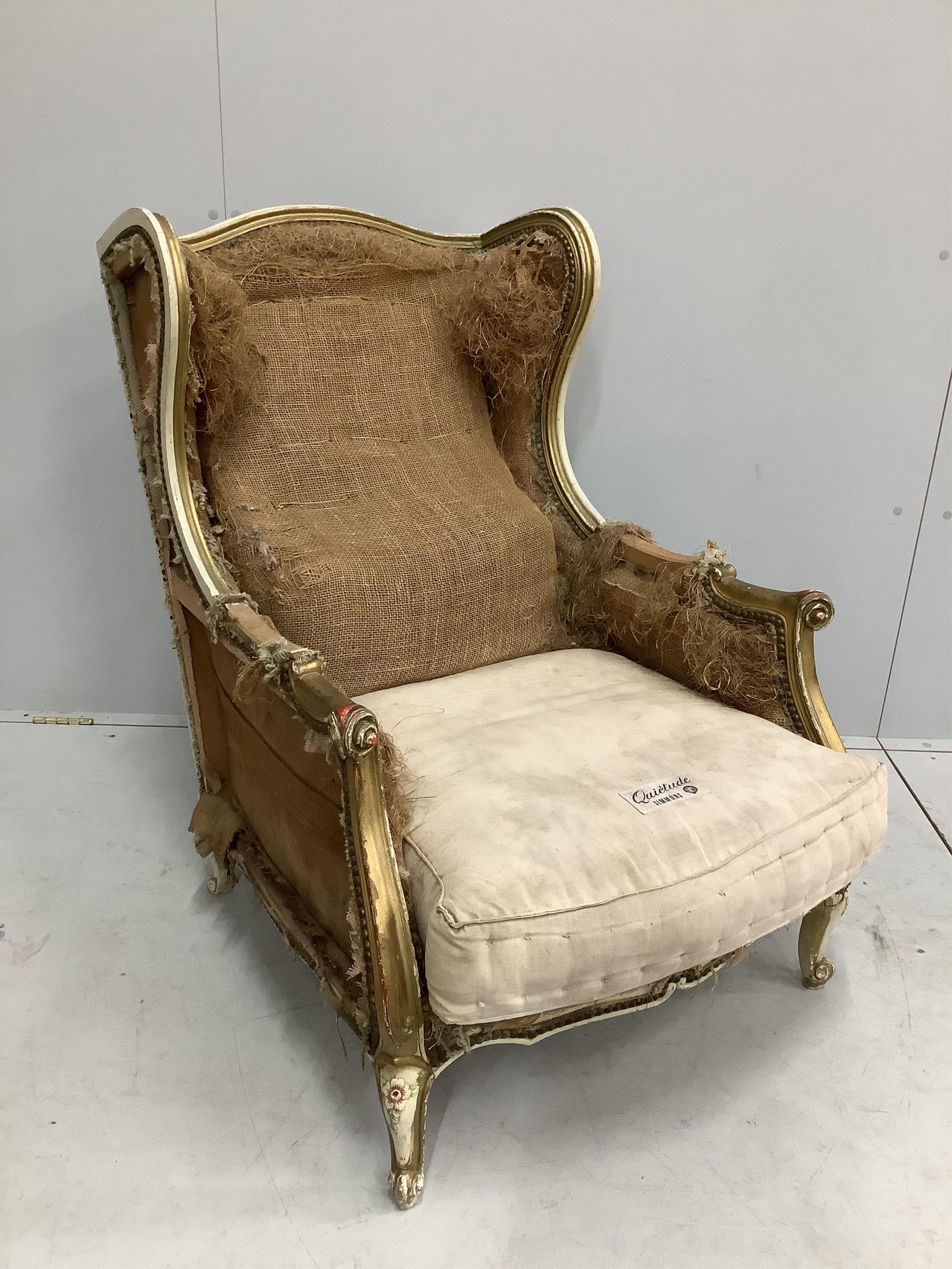 A 19th century French carved giltwood armchair requiring re-upholstery, width 70cm, depth 82cm, height 94cm